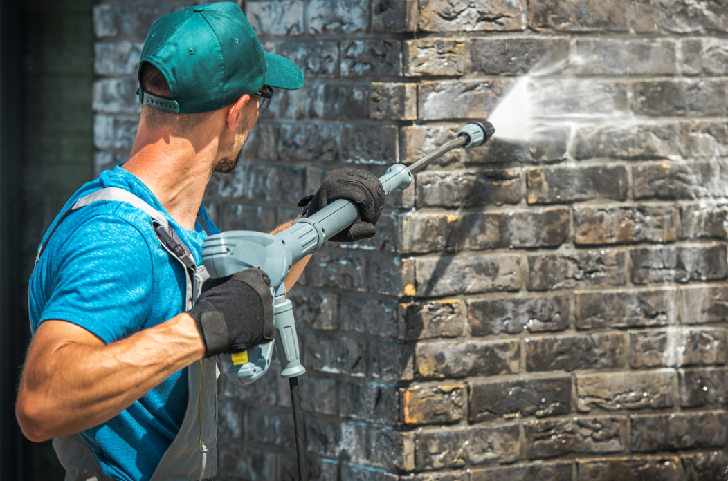 someone pressure washing 