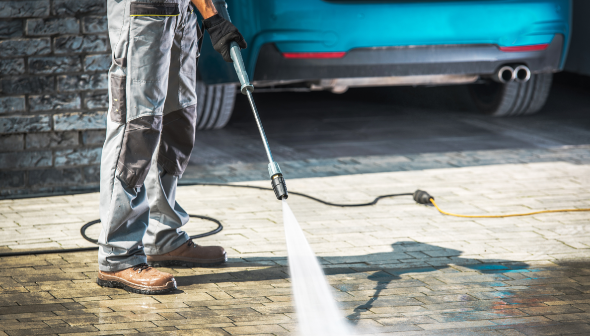 someone pressure washing 