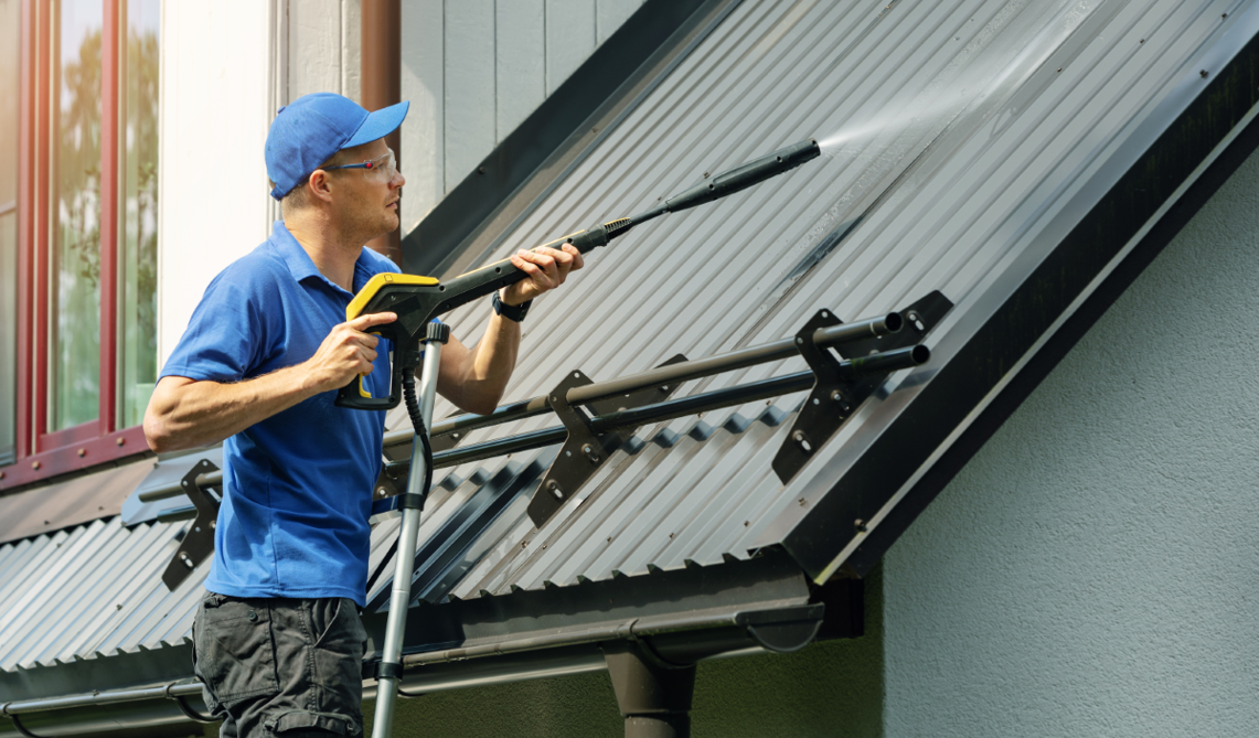 someone pressure washing the roof